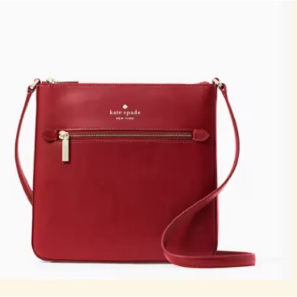 This is a bright red Kate Spade purse. - Picture 1 of 6